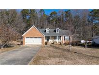 Brick ranch house with attached garage and porch at 540 Flint Ridge Ct, Jonesboro, GA 30238