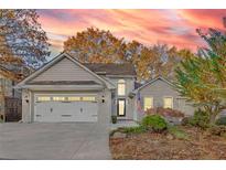 Attractive house with a two-car garage and manicured landscaping at 10120 Kinross Rd, Roswell, GA 30076