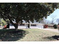 Charming single-story home featuring a well-maintained lawn and an inviting front entrance at 1988 Glenmar Dr, Decatur, GA 30032