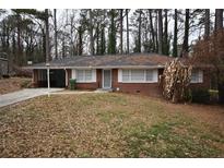 Brick ranch home with a large front yard and mature trees at 1121 Chatham Sw Ave, Atlanta, GA 30311