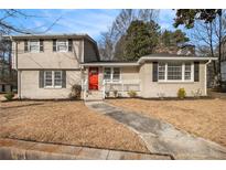 Two-story house with a red door and well-maintained lawn at 4079 Parks Ln, Douglasville, GA 30135