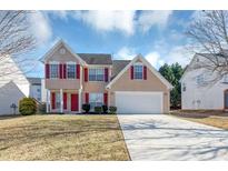 Two-story house with tan siding, red shutters, and a white garage door at 508 Cascade Walk, Mcdonough, GA 30253