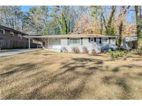 Charming single-story home featuring a well-maintained lawn and a classic brick facade at 3197 Cloverhurst Dr, Atlanta, GA 30344