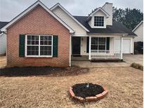 Charming single-story home featuring brick accents, vinyl siding and a well-manicured front yard with fresh landscaping at 3745 Hudson Ct, Rex, GA 30273