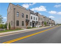 Brick townhomes showcase refined architecture and street-level appeal at 350 Sugarview Rd, Sugar Hill, GA 30518