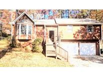 Ranch style home with two car garage and wooden deck at 5570 Deerfield Nw Pl, Kennesaw, GA 30144