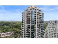 Modern high-rise building with floor-to-ceiling windows and balconies offering scenic views at 2520 Peachtree Nw Rd # 1202, Atlanta, GA 30305