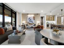 Bright, open living space features expansive windows and contemporary decor at 2520 Peachtree Nw Rd # 1202, Atlanta, GA 30305