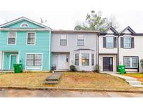 Charming townhomes featuring unique architecture, colorful exteriors and well-maintained yards at 1023 Thornwoode Ln, Stone Mountain, GA 30083