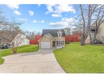 Charming home with manicured lawn and inviting driveway at 6118 Dorsett St, Douglasville, GA 30134