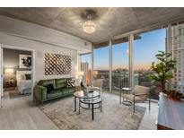 Spacious living room with city views and modern furniture at 3324 Peachtree Ne Rd # 1114, Atlanta, GA 30326