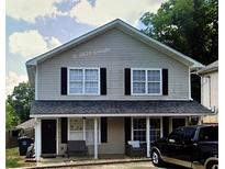 Two-story duplex with covered porches and a spacious yard at 151 Roy St # A & B, Canton, GA 30114