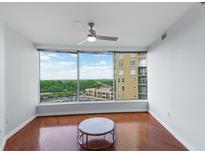 Bright living room with hardwood floors and city view at 3338 Peachtree Ne Rd # 1104, Atlanta, GA 30326