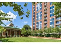 Luxury condo building with a beautifully landscaped courtyard at 1820 Peachtree Nw St # 1909, Atlanta, GA 30309