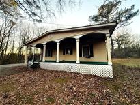 Ranch home with a covered porch and a large yard at 2675 Flat Shoals Rd, Decatur, GA 30034