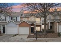 Brick front townhouse with 2-car garage, and a charming front porch at 577 Reed Se St, Atlanta, GA 30312