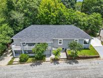 Stunning aerial view of a large two-story home with mature trees and a well-maintained yard at 261 Fletcher Sw St, Atlanta, GA 30315