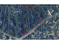 Aerial view showing a large lot of land near a road at 261 Mount Vernon Nw Hwy, Atlanta, GA 30328