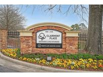 Entrance to Clairmont Place, a senior living community with well-maintained landscaping and a brick sign at 1800 Clairmont Lk # 413, Decatur, GA 30033