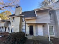 Two-story townhome with front entrance and landscaping at 4411 Idlewood Ln, Tucker, GA 30084