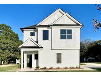 Two-story white house with black accents and a landscaped lawn at 111 Cassville-White, Cartersville, GA 30121