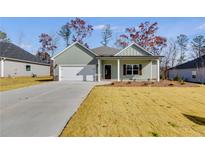 Charming craftsman style home with a front porch and attached two-car garage at 8870 Callaway Dr, Winston, GA 30187