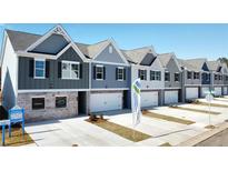 New townhome community with multiple units, featuring gray and white siding at 11583 Chatham Dr, Hampton, GA 30228