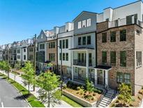 Row of new townhouses with modern brick and siding at 1779 Beckham Ne Pl # 58, Atlanta, GA 30324