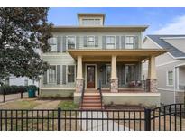 Two-story house with gray siding, shutters, and a front porch at 2616 Highland Se Ave, Smyrna, GA 30080