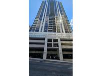 High-rise building exterior with parking and street view at 1280 W Peachtree W St # 1407, Atlanta, GA 30309