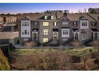 Charming multi-story townhome with brick facade, well-maintained landscaping, and inviting entrance at 4178 Butler Dr # 98, Atlanta, GA 30341