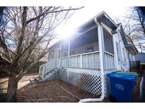Charming house with a wrap-around porch and a spacious yard at 744 Law Nw St, Atlanta, GA 30318