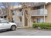 Two-story building exterior with balconies and landscaping at 3135 Seven Pines Ct # 106, Atlanta, GA 30339