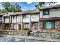 Brick townhouse exterior with stone accents and landscaping at 1190 Ashborough Se Dr # C, Marietta, GA 30067