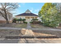 Charming one-story house with well-manicured lawn and walkway at 615 Brookwater Dr, Stockbridge, GA 30281