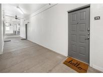 Bright hallway with modern gray door and concrete flooring at 821 Ralph Mcgill Ne Blvd # 3216, Atlanta, GA 30306