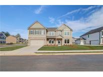Charming two-story home featuring a brick and siding facade, and a spacious two-car garage at 501 Dolce Rd, Locust Grove, GA 30248