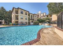 Inviting community pool with brick decking and lounge chairs at 3777 Peachtree Ne Rd # 1335, Brookhaven, GA 30319