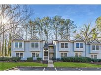 Inviting light blue townhome with landscaping and ample parking at 41 Doranne Se Ct, Smyrna, GA 30080