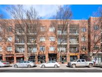 Brick building exterior with ample parking and street-level retail at 333 Nelson Sw St # 404, Atlanta, GA 30313