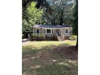 Ranch style home with a spacious yard and mature trees at 1228 Elizabeth Sw Ave, Atlanta, GA 30310
