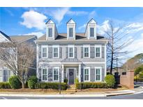 Gray two-story house with gray shutters, stone steps, and landscaping at 100 Kendemere Pointe, Roswell, GA 30075