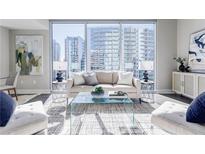 Bright and airy living room with floor to ceiling windows and modern furnishings at 20 10Th Nw St # 901, Atlanta, GA 30309