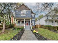 Two-story craftsman home with a charming front porch and well-manicured landscaping at 107 Howard Ne St, Atlanta, GA 30317