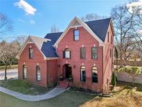 Brick two-story house with a landscaped yard at 632 Graymont Dr, Grayson, GA 30017