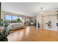 Bright living room featuring a large window with city views and modern decor at 3481 Ne Lakeside Dr # 1508, Atlanta, GA 30326