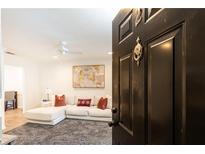 Inviting living room with a comfortable white sectional sofa, stylish decor, and neutral color palette at 1101 Collier Nw Rd # U2, Atlanta, GA 30318