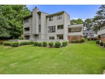 Two-story townhome with private backyard and grassy area at 2464 Cedar W Brk, Marietta, GA 30067