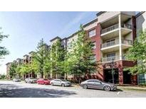 Brick apartment building with ample parking and landscaping at 870 Mayson Turner Rd # 1326, Atlanta, GA 30314