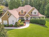 Two-story house with stone accents and a large front yard at 5339 Saville Nw Dr, Acworth, GA 30101